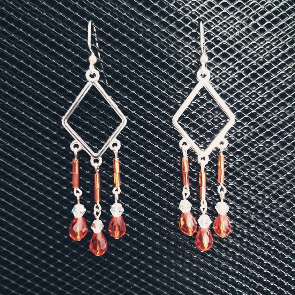 Silver diamond shapes with orange and clear iridescent glass crystal earrings